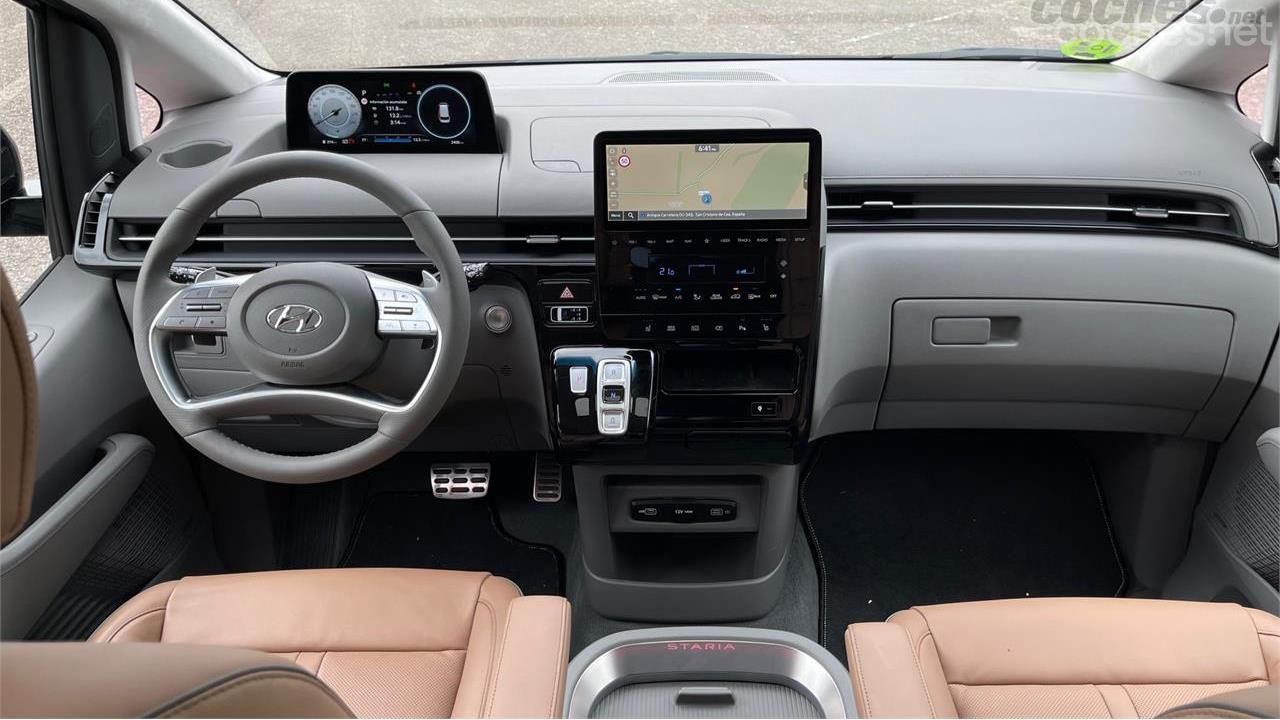 Two screens, both 12.5 inches, preside over a cleanly designed dashboard and multiple glove compartments.